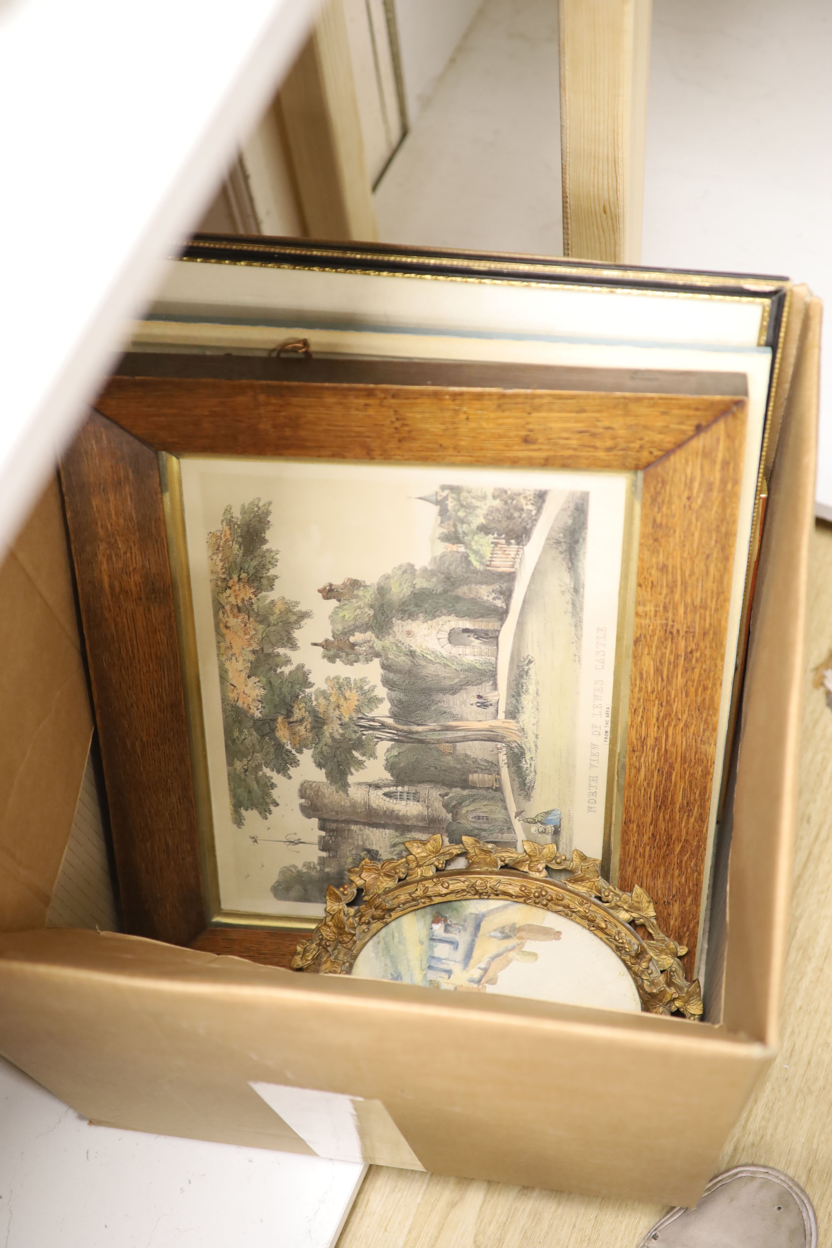 A group of five 19th Century coloured lithograph Views of Lewes, and a small oval watercolour of a village, largest 26 x 33cm.